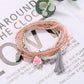 Lovra bracelet with pink tassel and mixed beads arranged in multiple rows