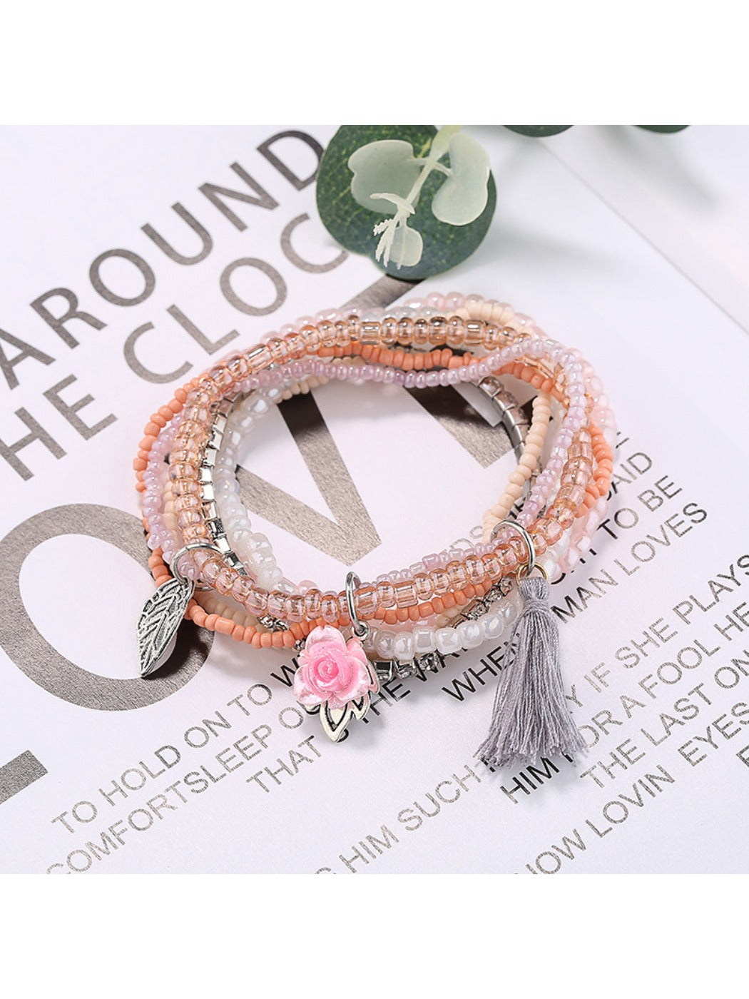Lovra bracelet with pink tassel and mixed beads arranged in multiple rows