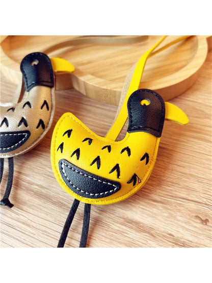 Side view of the little ostrich keychain highlighting its curved neck
