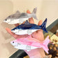Top view of Beau shark shape claw clip highlighting curved jaw and teeth
