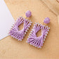 Earedge raffia square drop earrings shown from front and back angles
