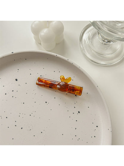 Beau sweet cute hair clip displayed on white background showing glossy finish