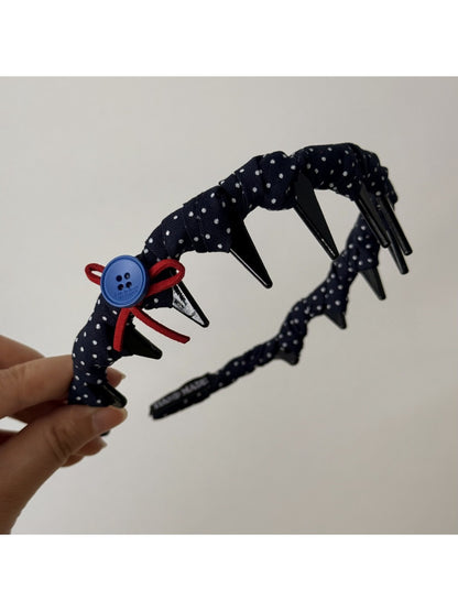 Blue scrunchie and headband set styled on a wooden surface