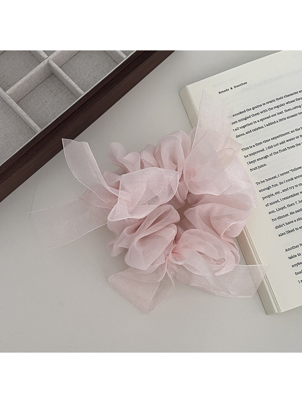 Gifty scrunchie worn on a wrist as a stylish accessory