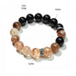 Lovra Crystal Obsidian Beaded Bracelet worn on wrist with natural lighting emphasizing bead gloss
