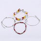 Set of Lovra boho stackable beaded bracelets displayed on a white surface
