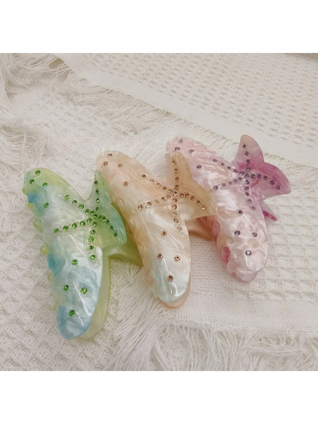 Close-up of Beau rainbow color claw clip with vibrant multicolor design