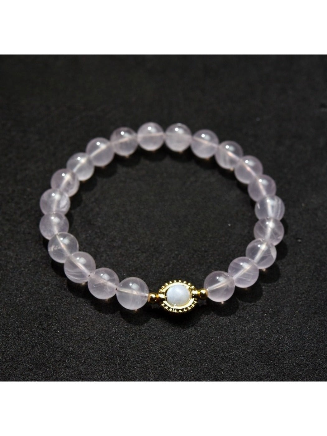 Lovra pastel beaded bracelet on a wooden surface, showcasing bead colors and smooth finish