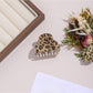 Beau leopard print hair clip displayed alongside matching accessories