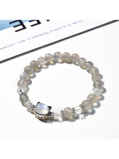 Lovra gray crystal beaded bracelet worn on a wrist with a neutral background