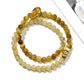 Multiple Lovra minimalist beaded bracelets stacked together on a wrist