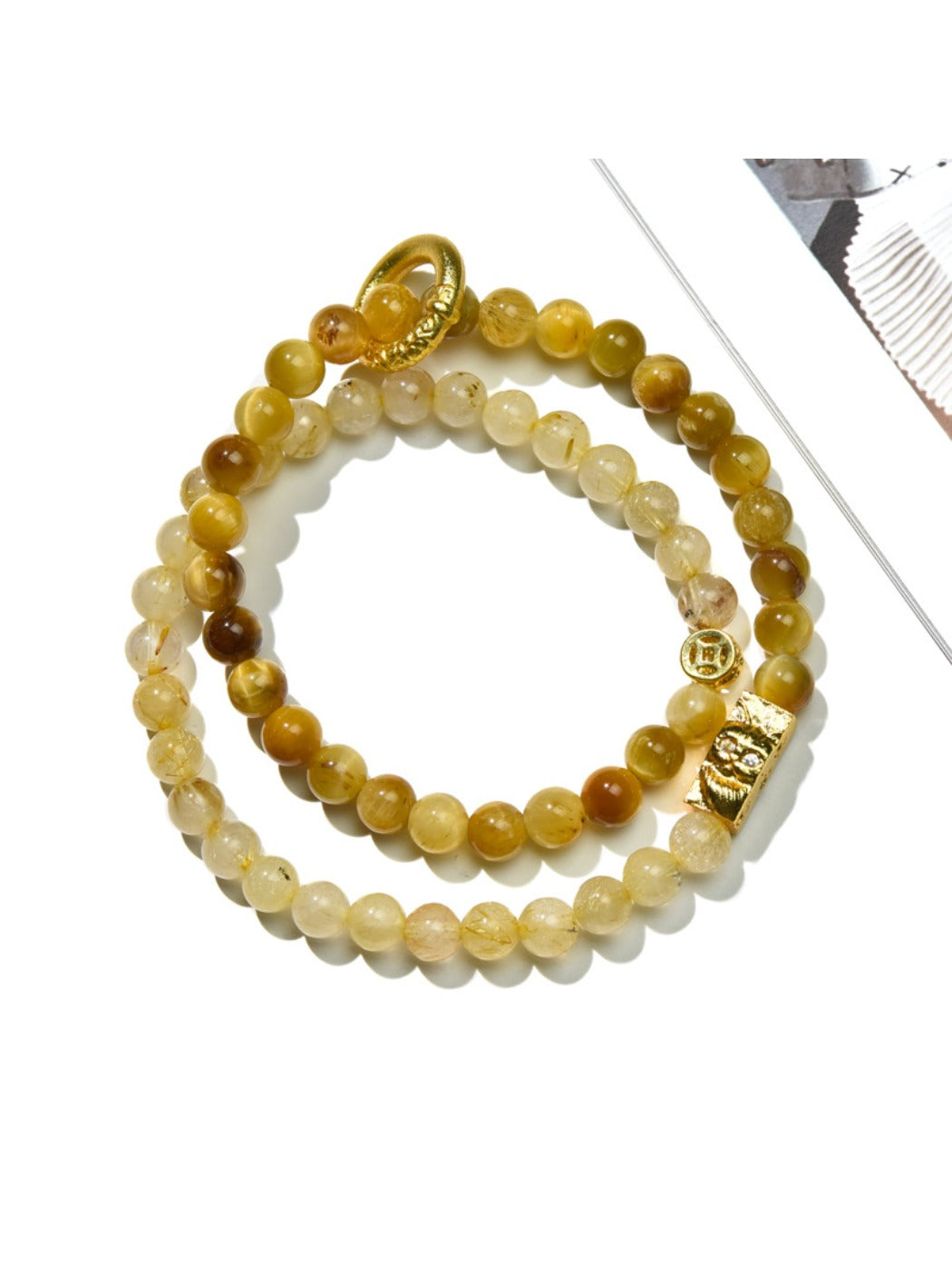 Multiple Lovra minimalist beaded bracelets stacked together on a wrist