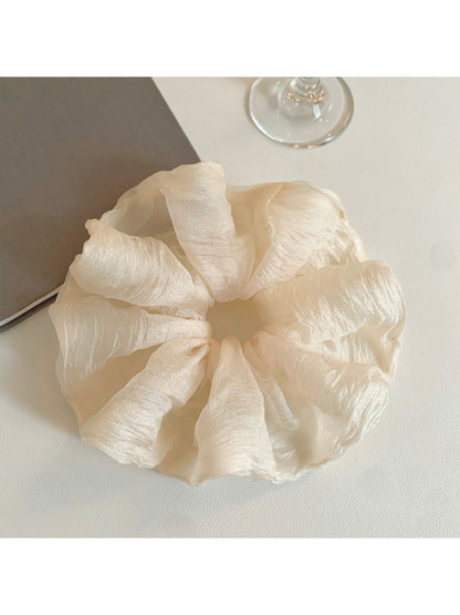 Scrunchie styled on a wrist as a simple, elegant accessory