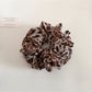 Scrunchie with vintage leopard print worn on wrist as a bracelet