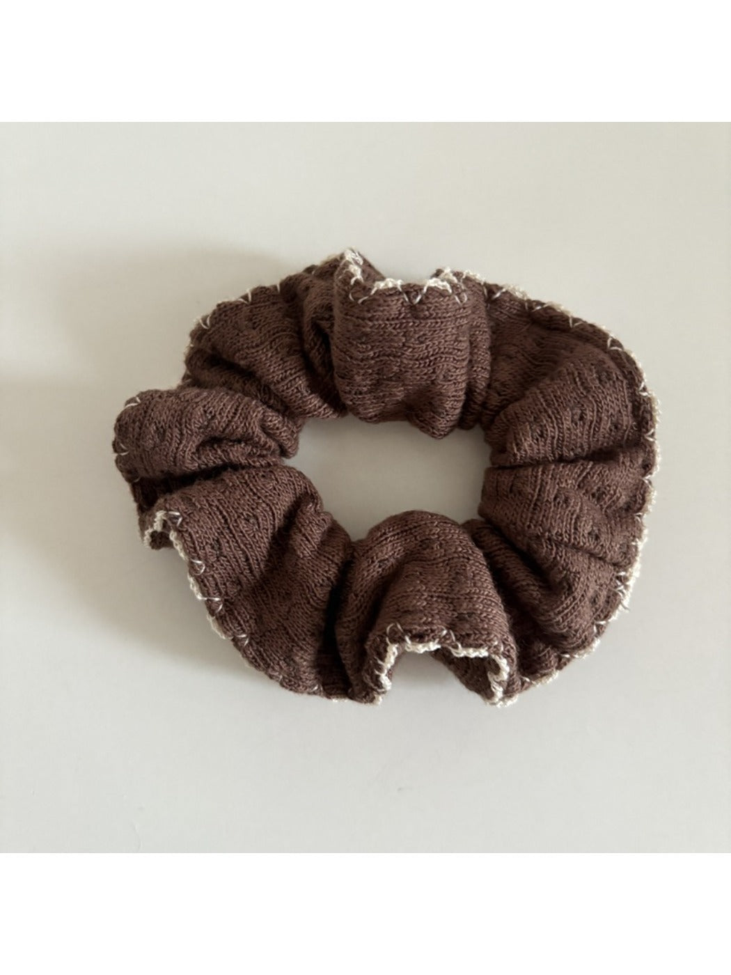 Gifty scrunchie laid flat to display full fabric design and elastic band