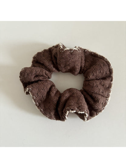 Gifty scrunchie laid flat to display full fabric design and elastic band