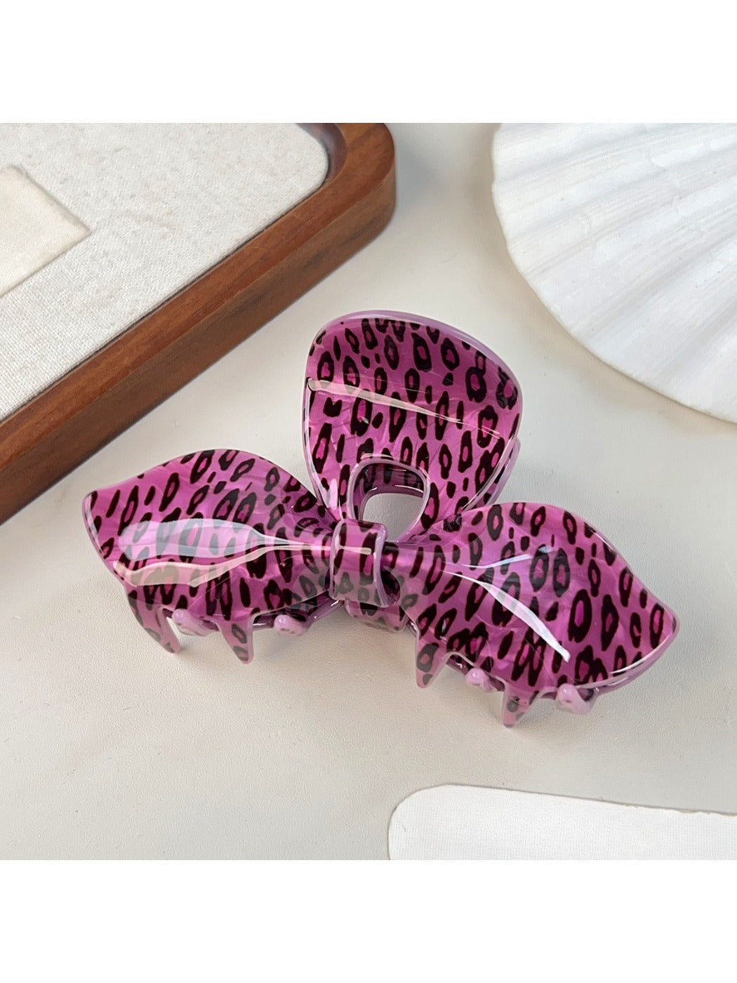 Top view of Beau leopard print bow-shaped hair claw clip