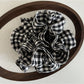 Black and white check vintage scrunchie held in hand showing size