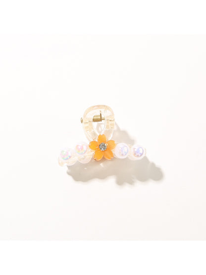 Bright multi color hair clip shown from top angle highlighting colors