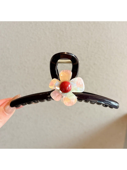 Side view of the pink flower claw clip showing the clasp mechanism