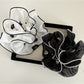 Close-up of a fresh elegant beautiful scrunchie in soft pastel color