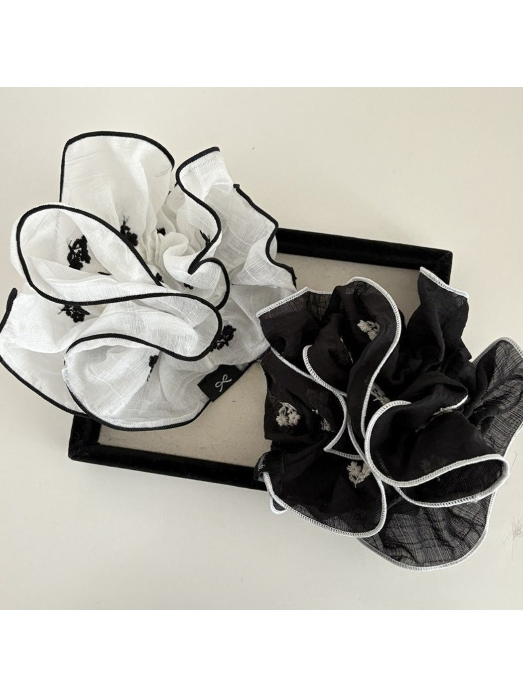 Close-up of a fresh elegant beautiful scrunchie in soft pastel color