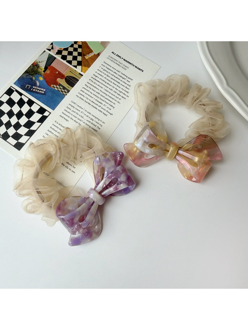Side view of Gifty scrunchie showing mesh bow detail and acetate material