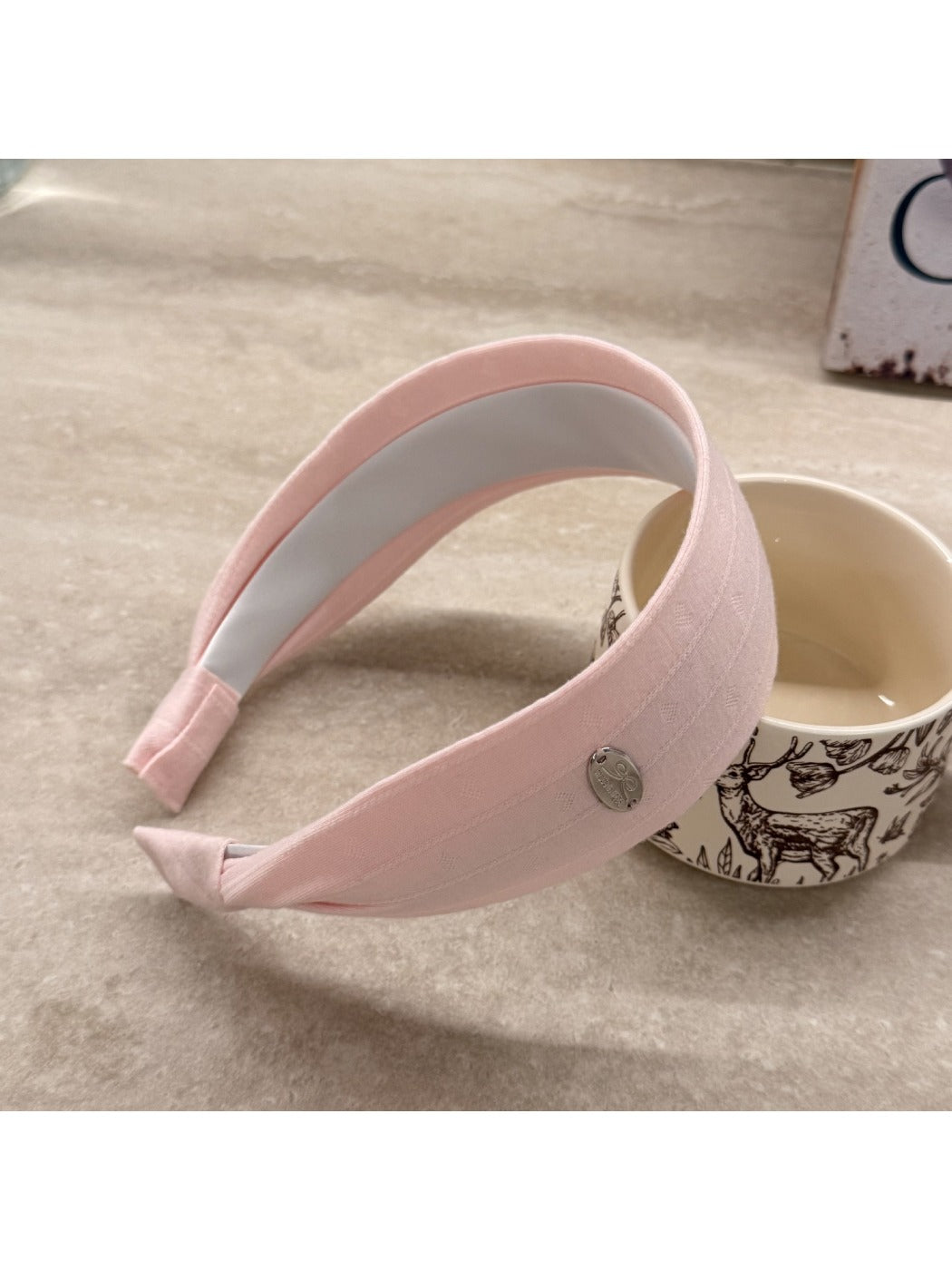 Side view of Gifty simple wide headband on model's head