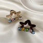 Beau delicate five pointed star shaped claw clip in glossy black finish