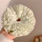 Gifty ruched scrunchie displayed on a white background showing fabric texture