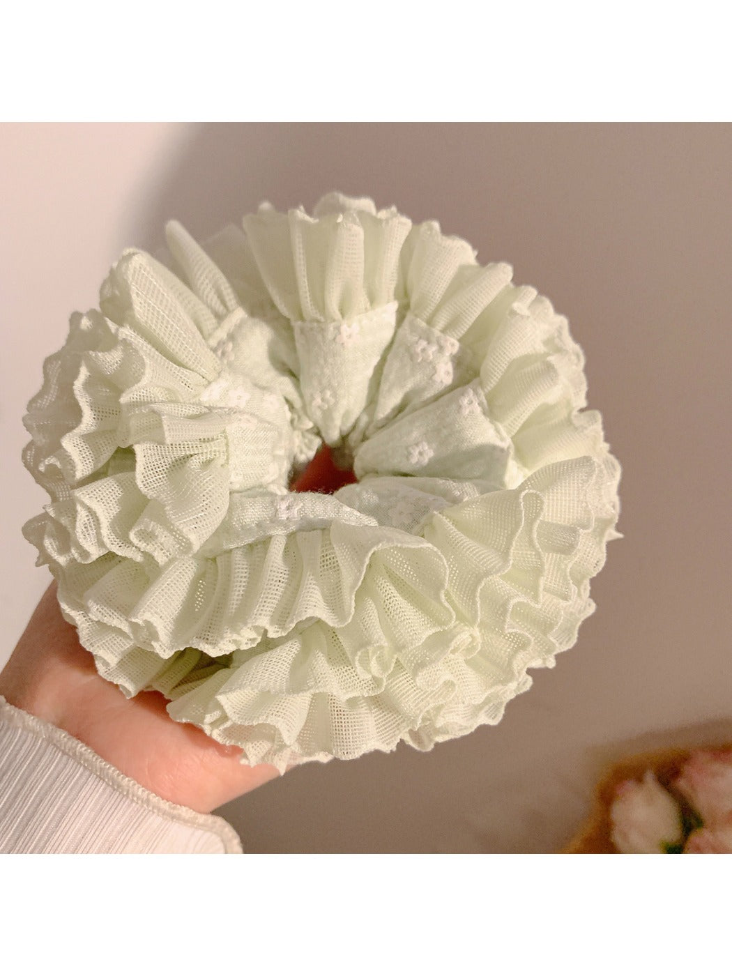 Gifty ruched scrunchie displayed on a white background showing fabric texture