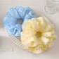Gifty minimalist solid color four layer scrunchie in soft pastel pink on white background