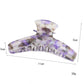 Beau acetate curved claw clip open, displaying curved teeth design