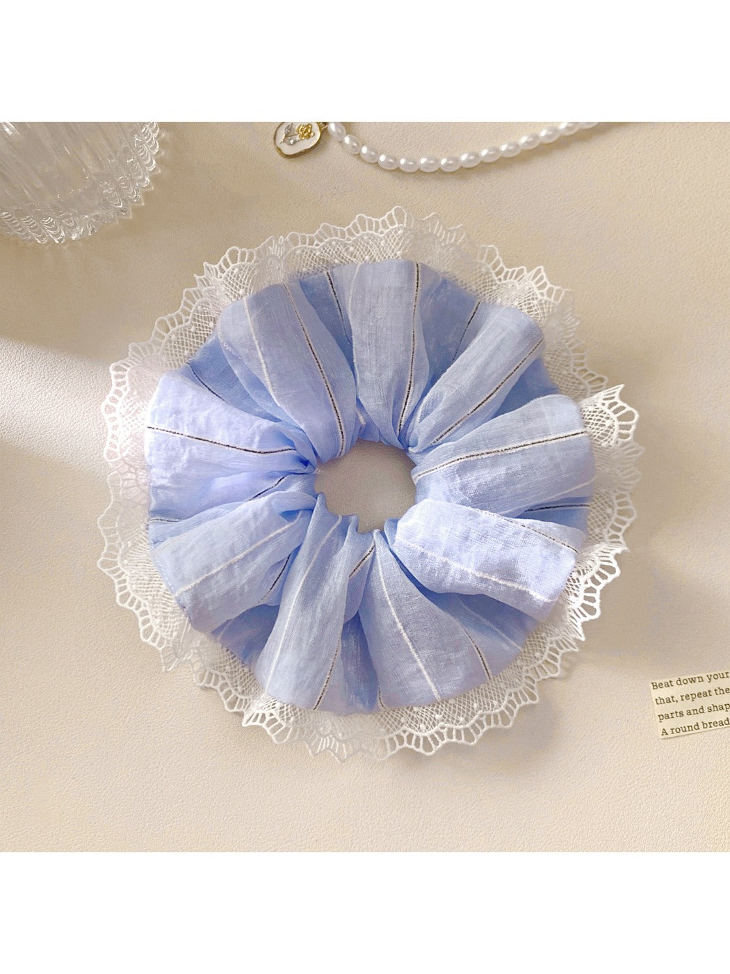 Gifty ruched scrunchie holding a ponytail with visible stripes