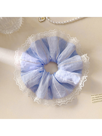 Gifty ruched scrunchie holding a ponytail with visible stripes