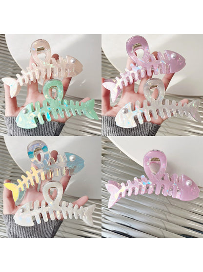Close-up of Beau fishbone acetate hair clip showing detailed pattern and texture
