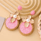 Earedge chic circular floral drop earrings styled with casual outfit on model