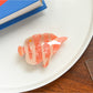 Beau tropical fish shaped hair clip shown with other colorful hair accessories