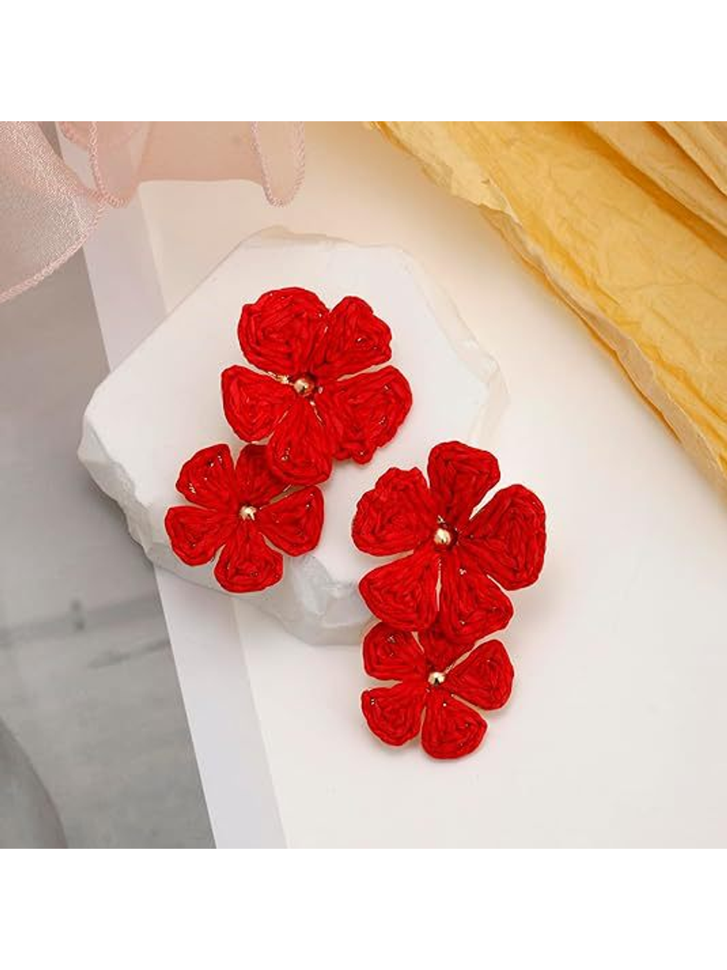 Earedge raffia drop earrings with floral pendant shown in natural light
