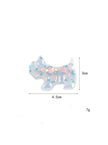 Side view of Beau puppy hair clip highlighting the clip mechanism and shape