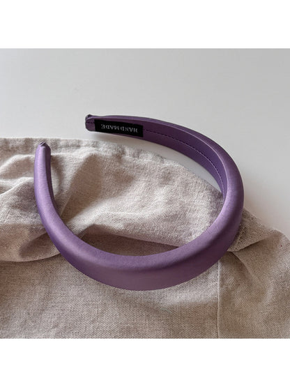 Purple wide edge headband displayed alongside other color options