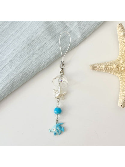 Mini fish keychain in red color shown on a keyring with keys