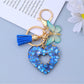 Keypus heart cutout pendant keychain held in a hand