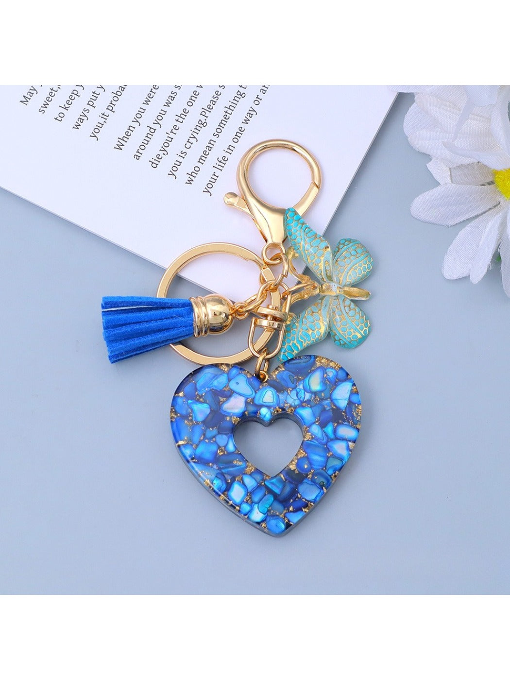 Keypus heart cutout pendant keychain held in a hand