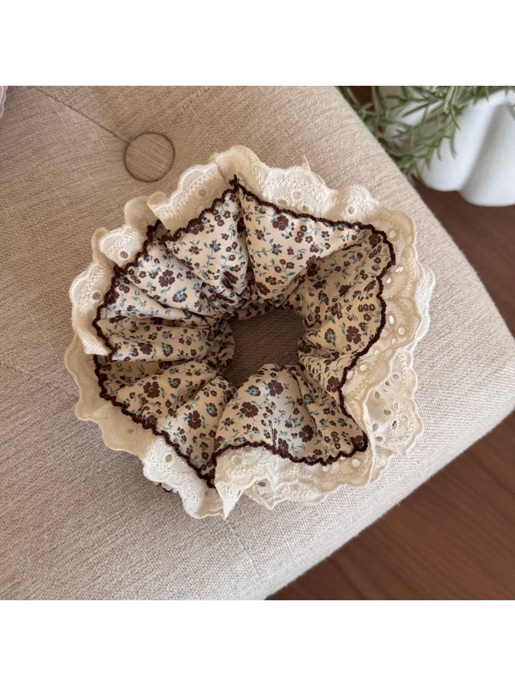 Gifty Retro Lace Floral Scrunchie held in hand showing size and delicate fabric design