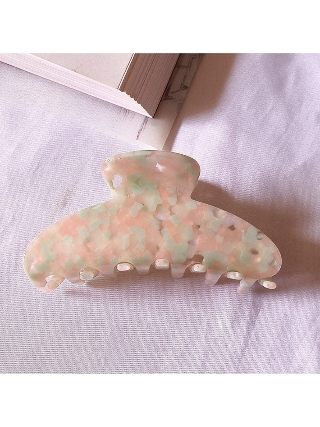 Beau chic tiny floral acetate claw clip styled in loose hair on model