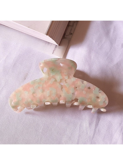Beau chic tiny floral acetate claw clip styled in loose hair on model