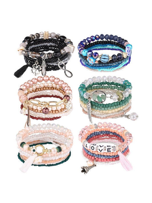 Close-up of Lovra vintage tassel stackable beaded bracelet with multicolored beads and tassel charm