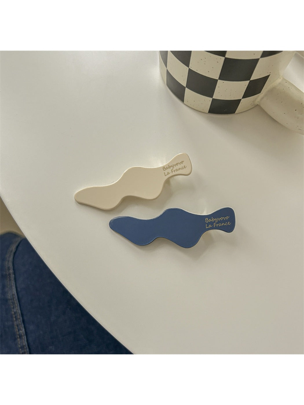 Beau blue and white hair clip styled in long brown hair