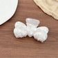 Beau bow shaped hair claw clip displayed on a white background